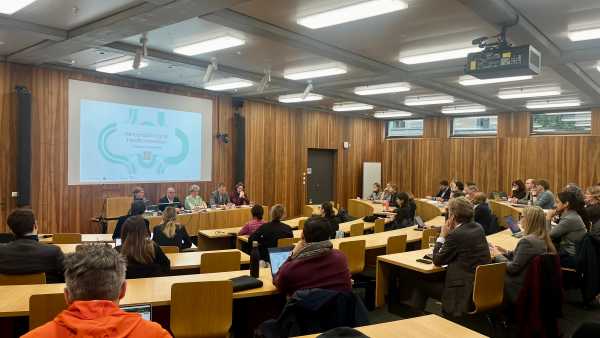 Panel speakers and audience at the launch event